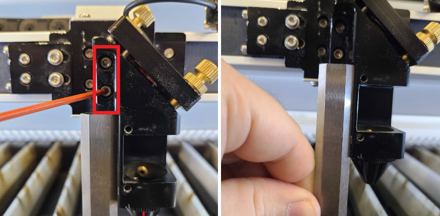 Allen key loosening the laser head mounting bolts