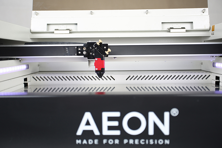front view of bed and laser head on the Aeon Mira CO2 Desktop Laser Cutting Machine