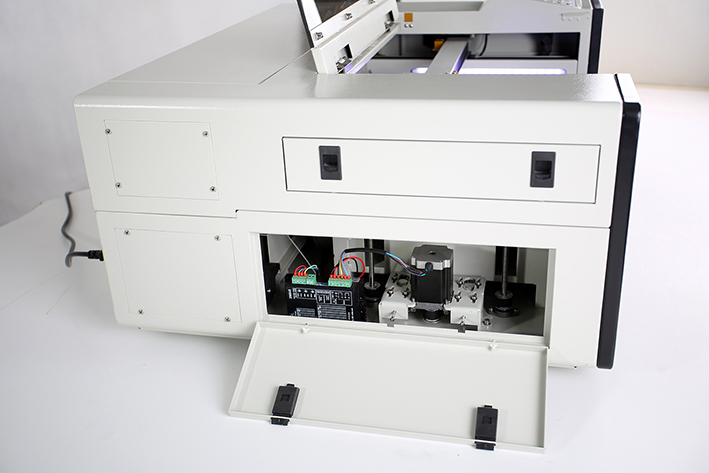 left panel opened, on the Aeon Mira CO2 Desktop Laser Cutting Machine