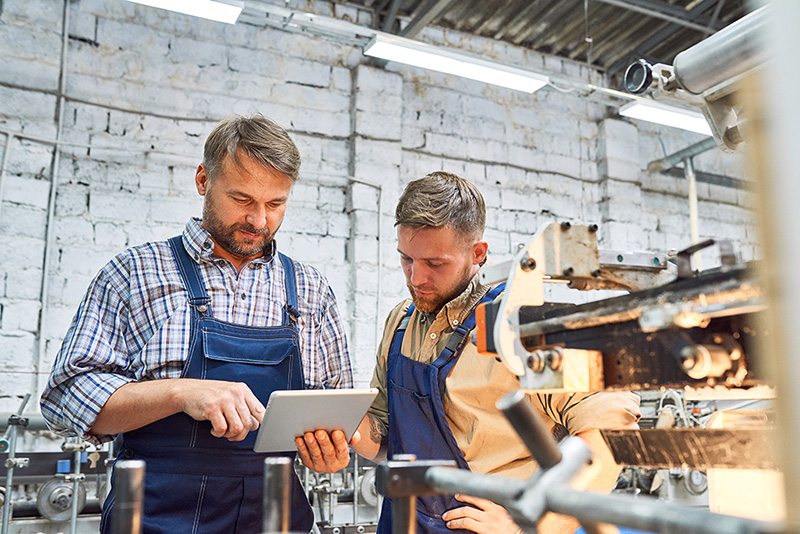 two guys in a workshop