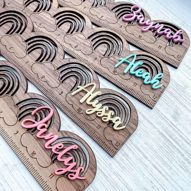 customer laser cut wooden rulers with rainbow and colorful names