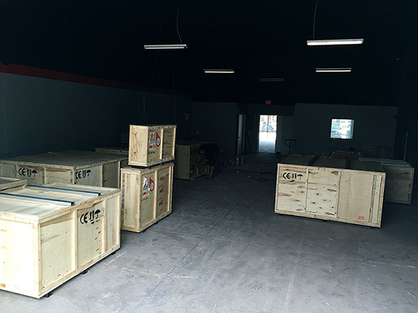 warehouse full of crates containing Bodor lasers