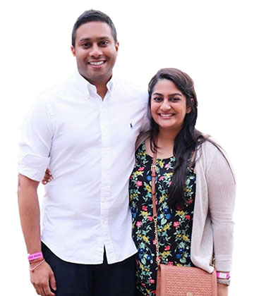 photo of Sumita and Anuj Patel standing side by side and smiling