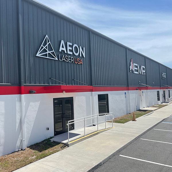 Aeon Laser USA and EMP logos on building